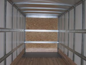 Interior of semi trailer with horizontal e-track and 2 front shoring board