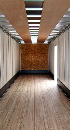 Interior shot of a Strick trailer, a leading Semi-Trailer Manufacturer, showcasing a plywood roof runner